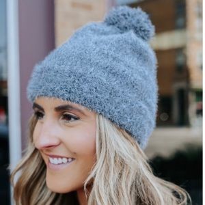 Charcoal, cozy, & soft beanie with a pom on top!